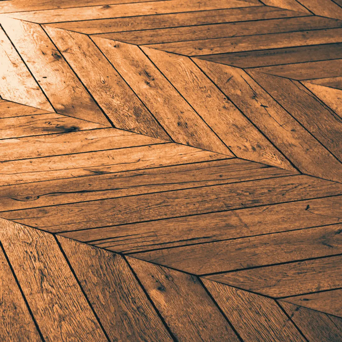 Lames de parquet aux tons chauds posées en motif